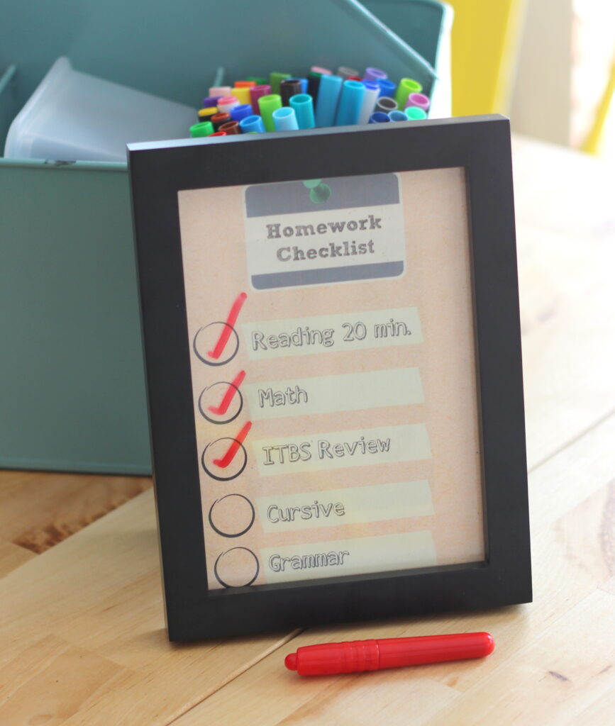 Homework checklist and pen, illustrating a written task-evaluation process.